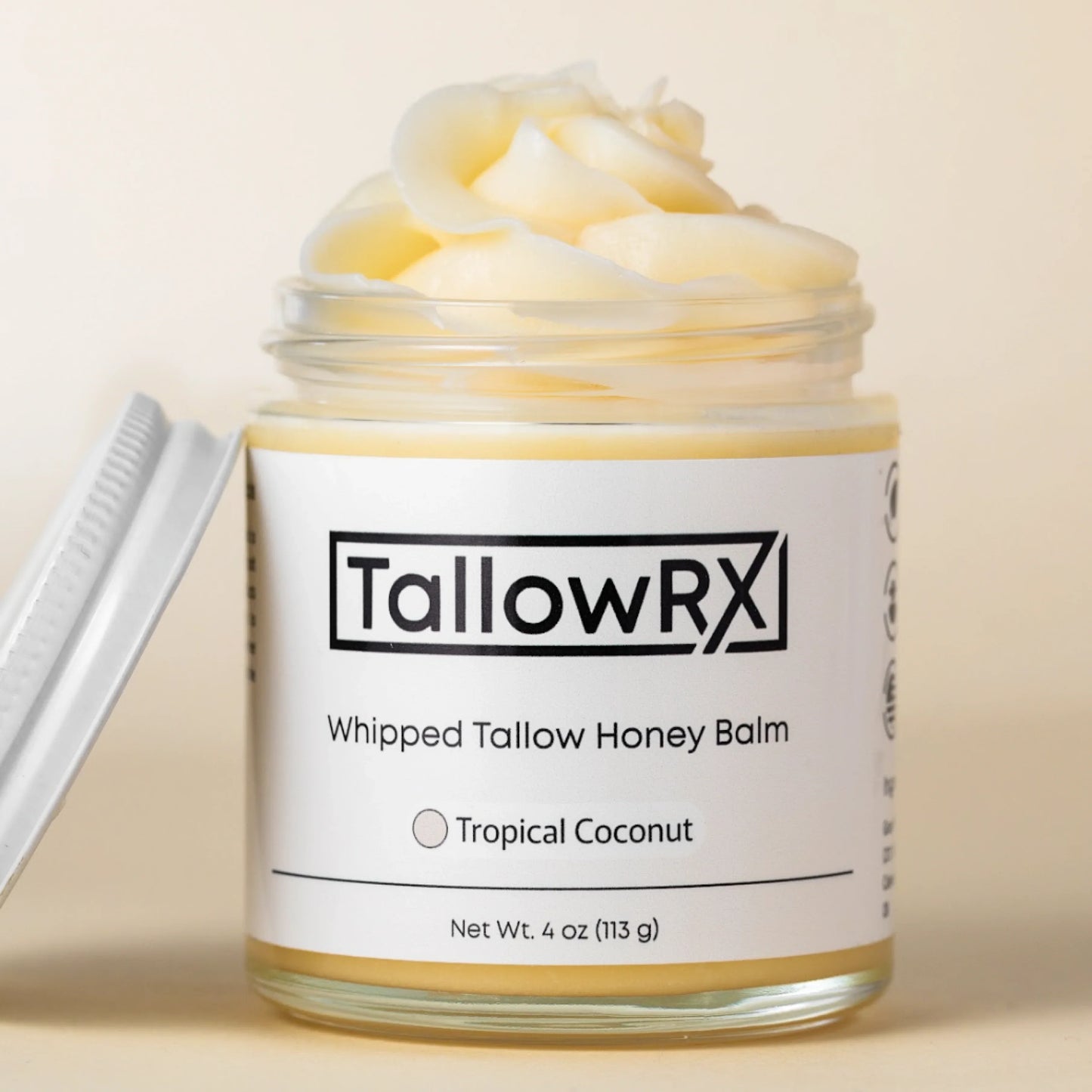 TallowRX Tropical Coconut Whipped Tallow Honey Balm in 4 oz glass jar with open lid, showing fluffy texture of natural moisturizer