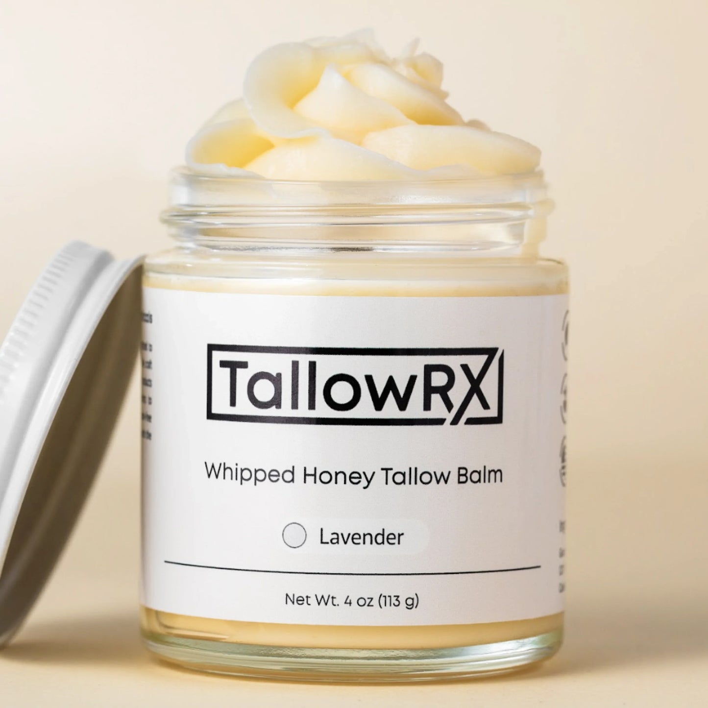 TallowRX Lavender Whipped Honey Tallow Balm in 4 oz glass jar with open lid, showcasing soft whipped texture of natural moisturizer